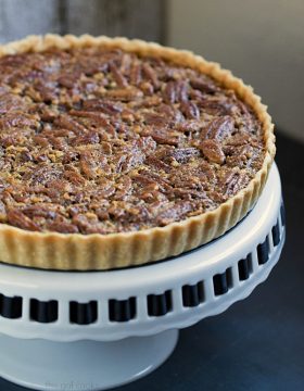 Classic Pecan Pie Tart - This Gal Cooks. This pecan pie is spiced up with the addition of cinnamon and spiced rum!